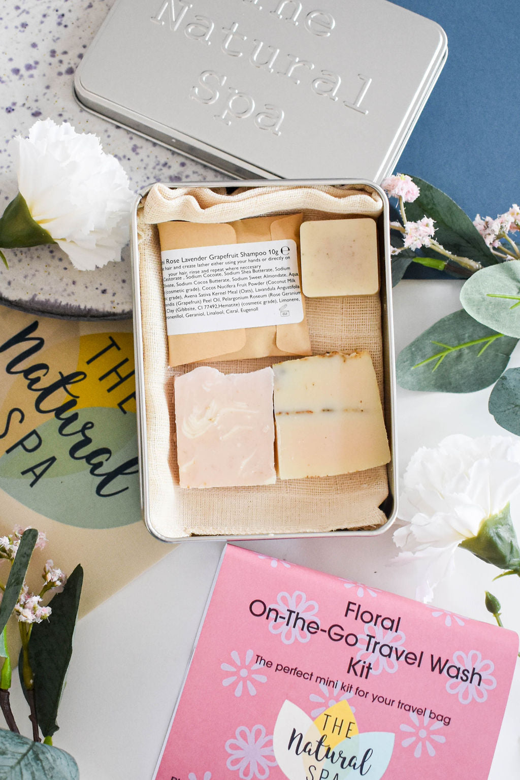 Citrus Mini 'on the go' Travel Wash kit featuring mini soap bars, shampoo, conditioner, and bamboo flannel in a compact travel tin.