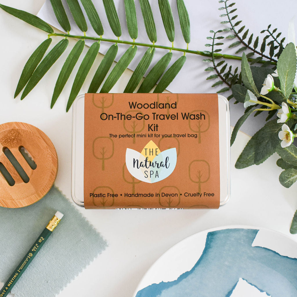 Citrus Mini 'on the go' Travel Wash kit featuring mini soap bars, shampoo, conditioner, and bamboo flannel in a compact travel tin.