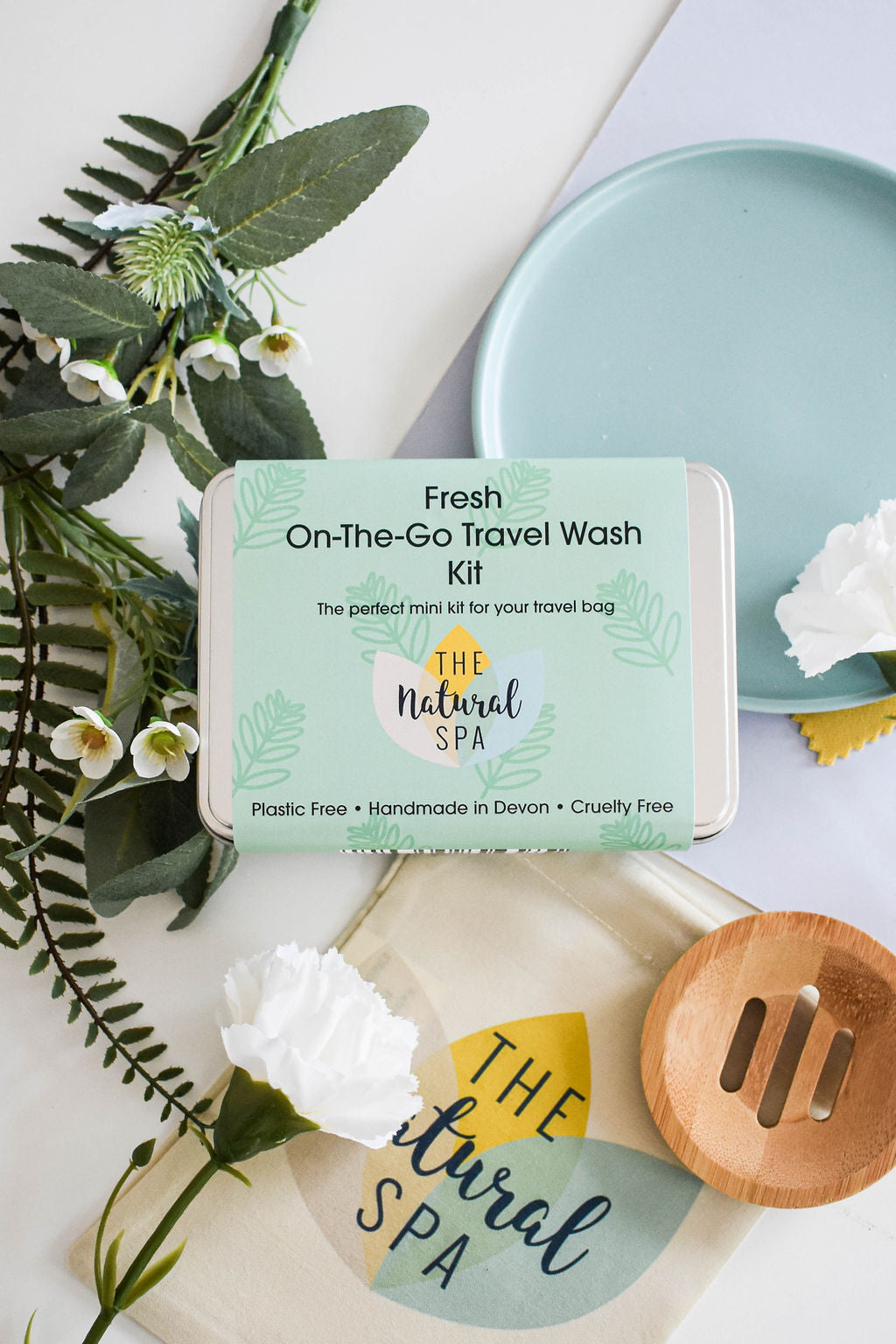 Citrus Mini 'on the go' Travel Wash kit featuring mini soap bars, shampoo, conditioner, and bamboo flannel in a compact travel tin.