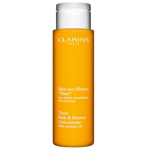 Clarins Tonic Bath & Shower Concentrate bottle with a refreshing design, showcasing its luxurious essence.