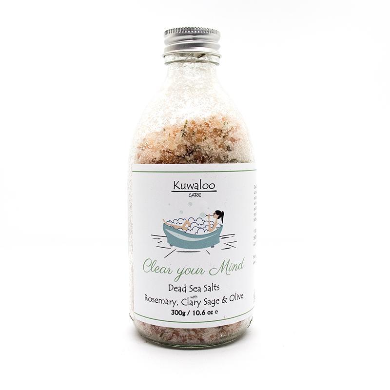 A bottle of 'Clear your Mind' Bath Salts, featuring Dead Sea minerals and essential oils for a relaxing bath experience.