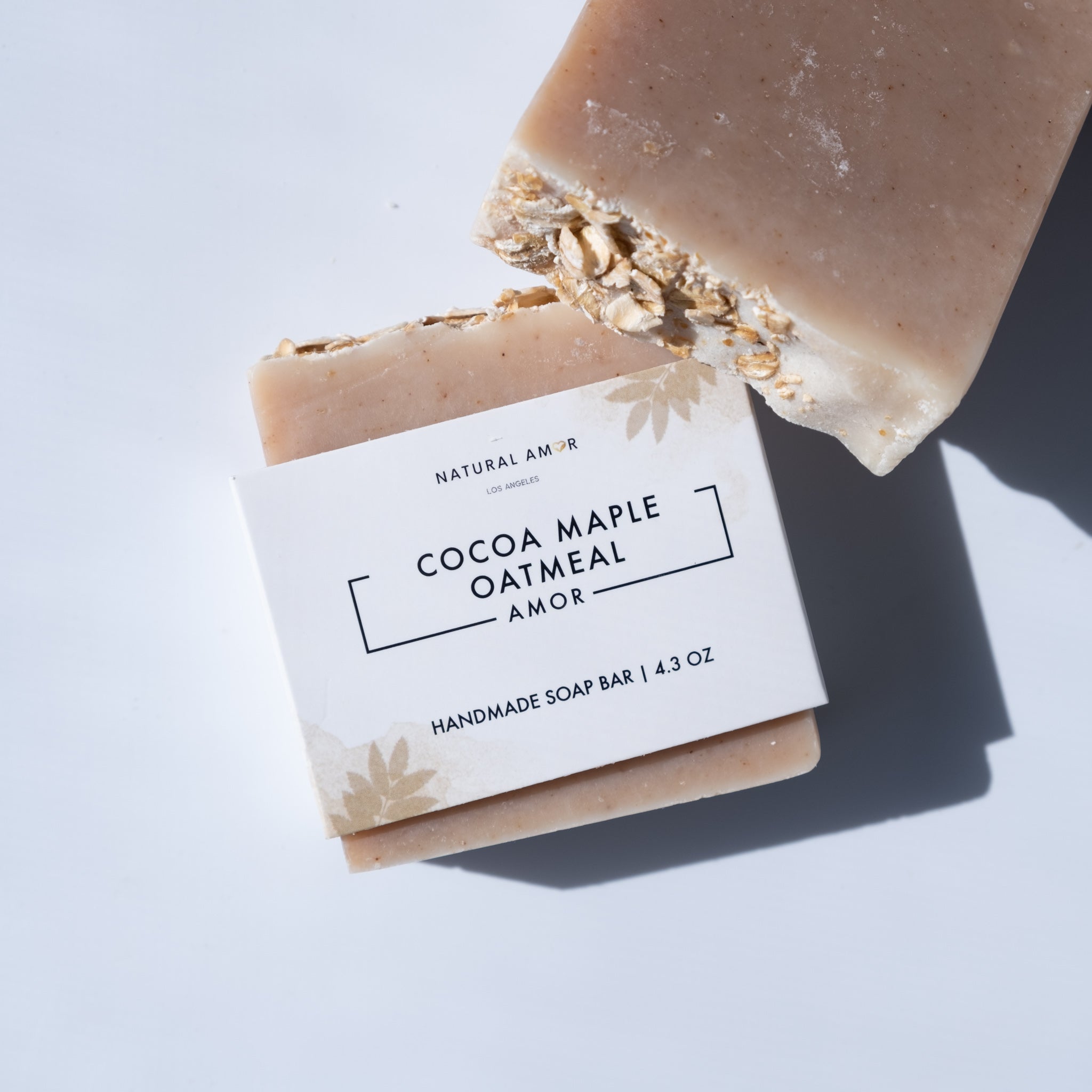 Cocoa Maple Oatmeal Soap Bar, a gentle unscented soap made with organic ingredients, featuring a rich brown color and oatmeal texture.