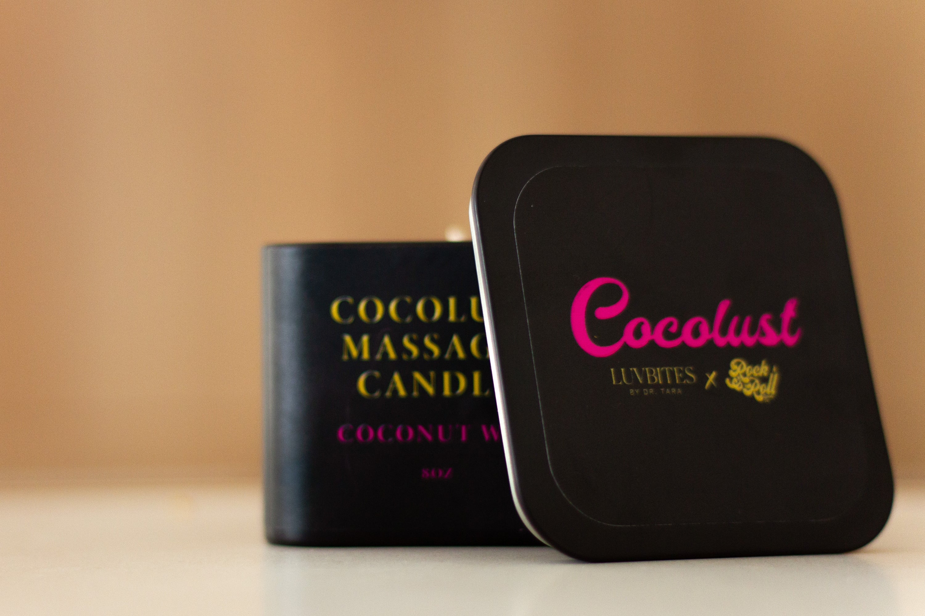 Cocolust Massage Candle in a stylish container, showcasing its coconut wax and inviting light coconut scent.