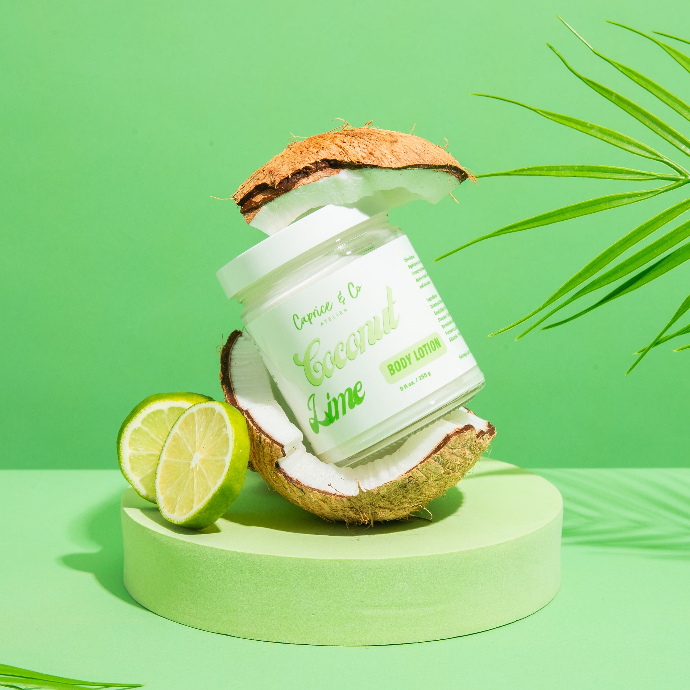 Coconut + Lime Body Lotion in a glass jar, showcasing its creamy texture and tropical scent.