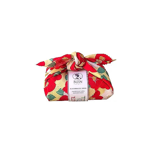 Coffret furoshiki de soins visage et corps avec emballage en crêpe de coton, contenant des produits antioxydants pour une peau nourrie.