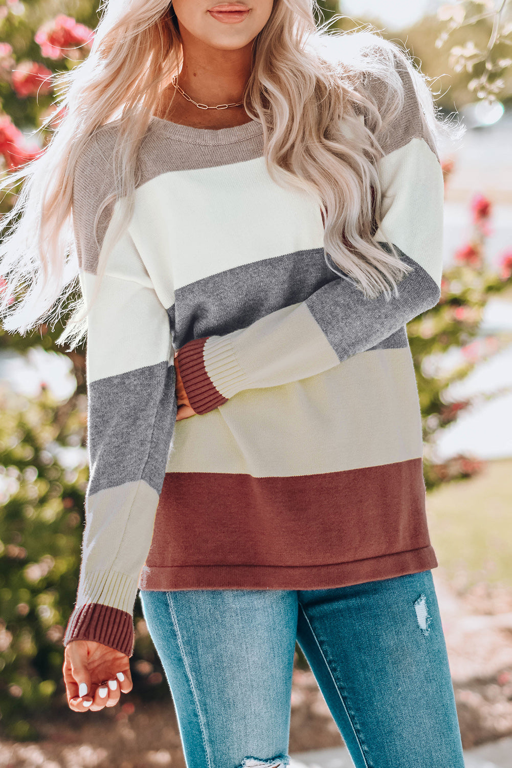 A stylish Colorblock Pocketed Sweater featuring a longline silhouette, vibrant color blocks, and convenient pockets, perfect for casual wear.