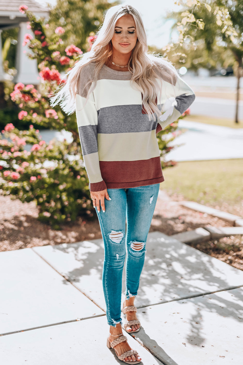 A stylish Colorblock Pocketed Sweater featuring a longline silhouette, vibrant color blocks, and convenient pockets, perfect for casual wear.