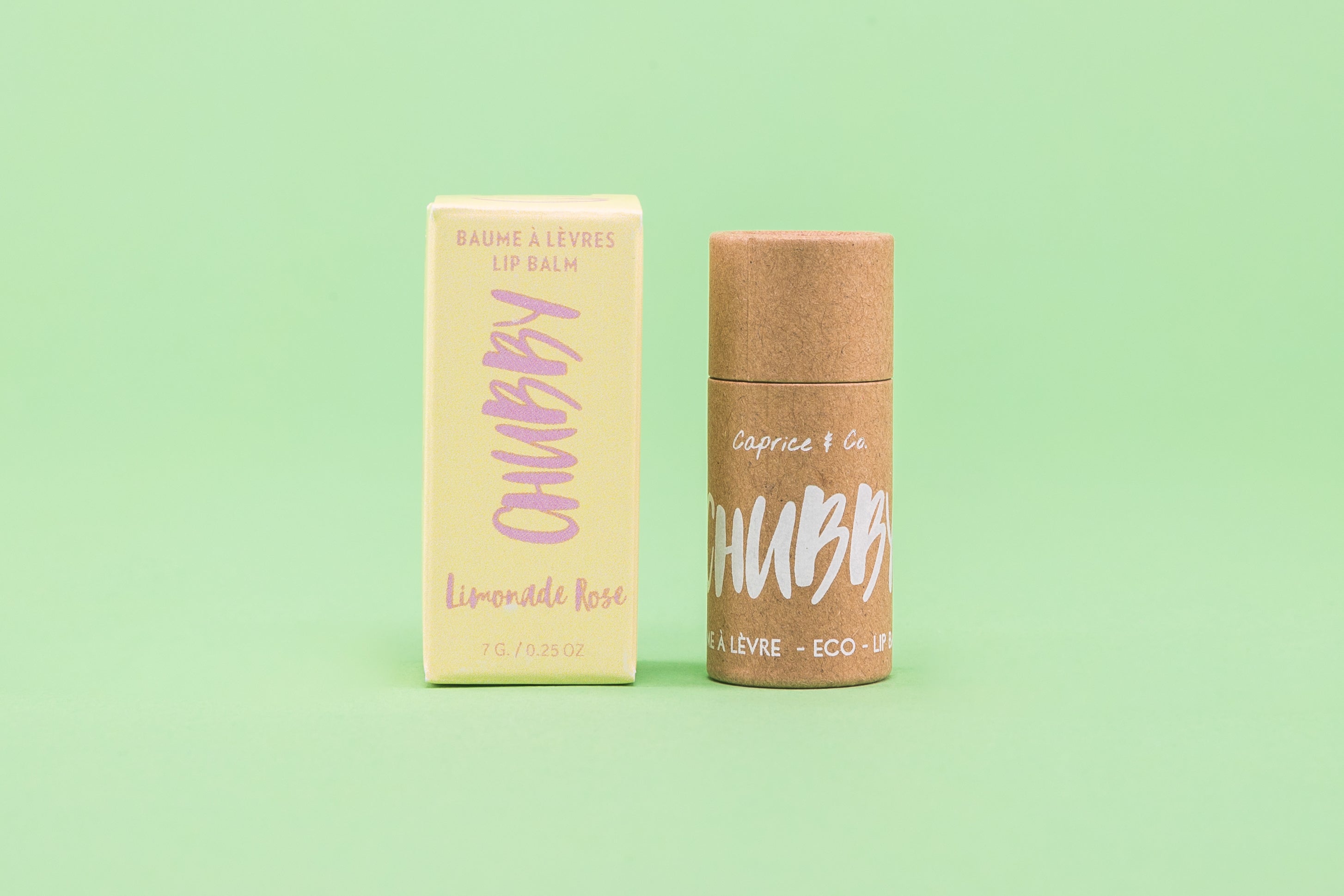 A tube of compostable vegan lip balm with a natural, eco-friendly design, showcasing its organic ingredients and biodegradable packaging.