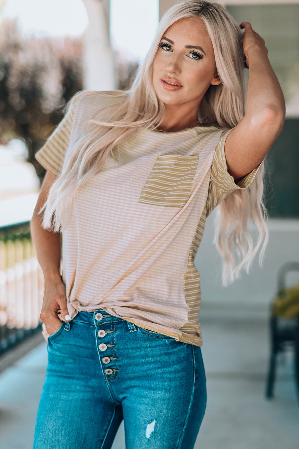 A stylish Contrast Striped Patchwork Tee featuring a round neckline, short sleeves, and a chest pocket, showcasing a vibrant color combination.