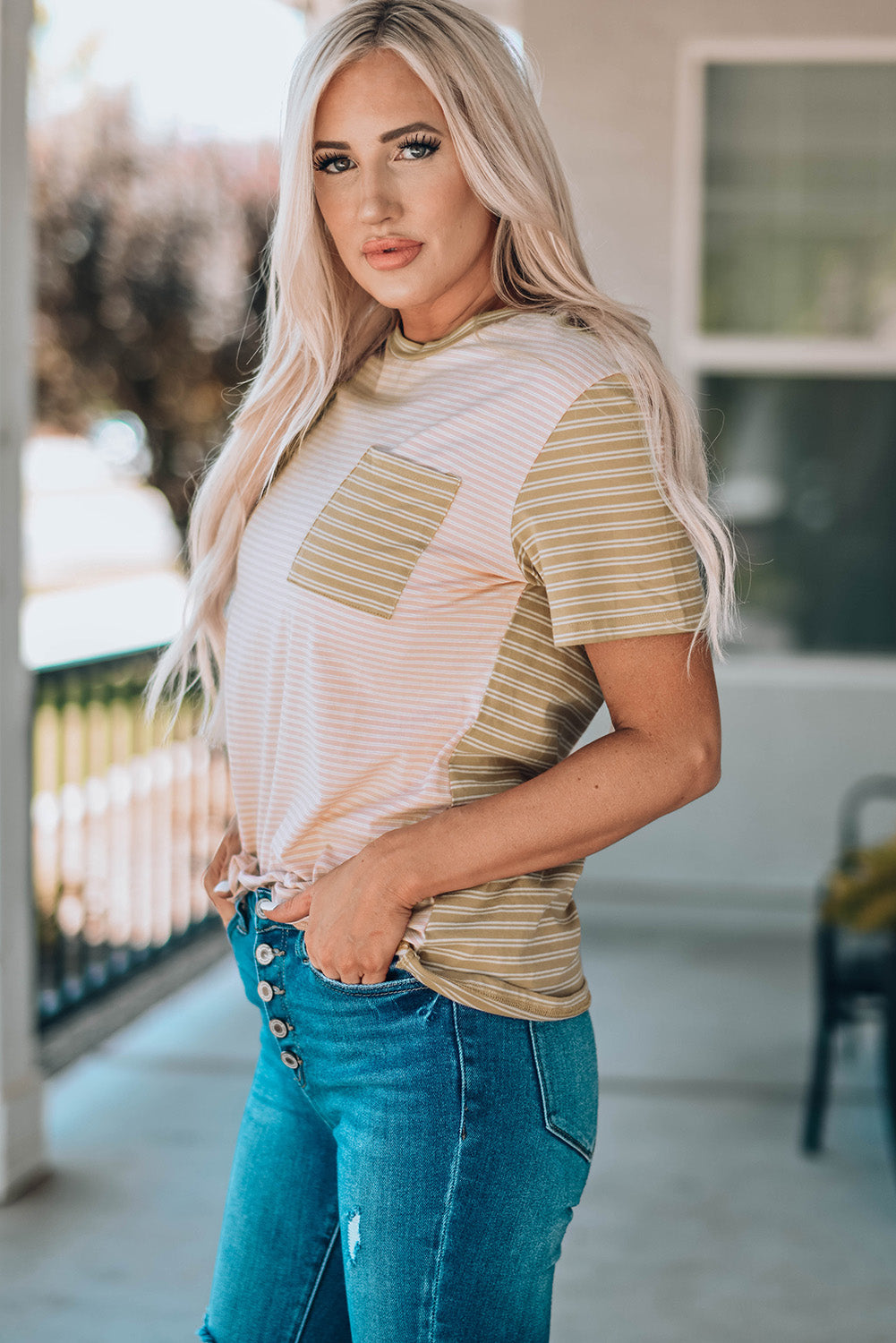 A stylish Contrast Striped Patchwork Tee featuring a round neckline, short sleeves, and a chest pocket, showcasing a vibrant color combination.