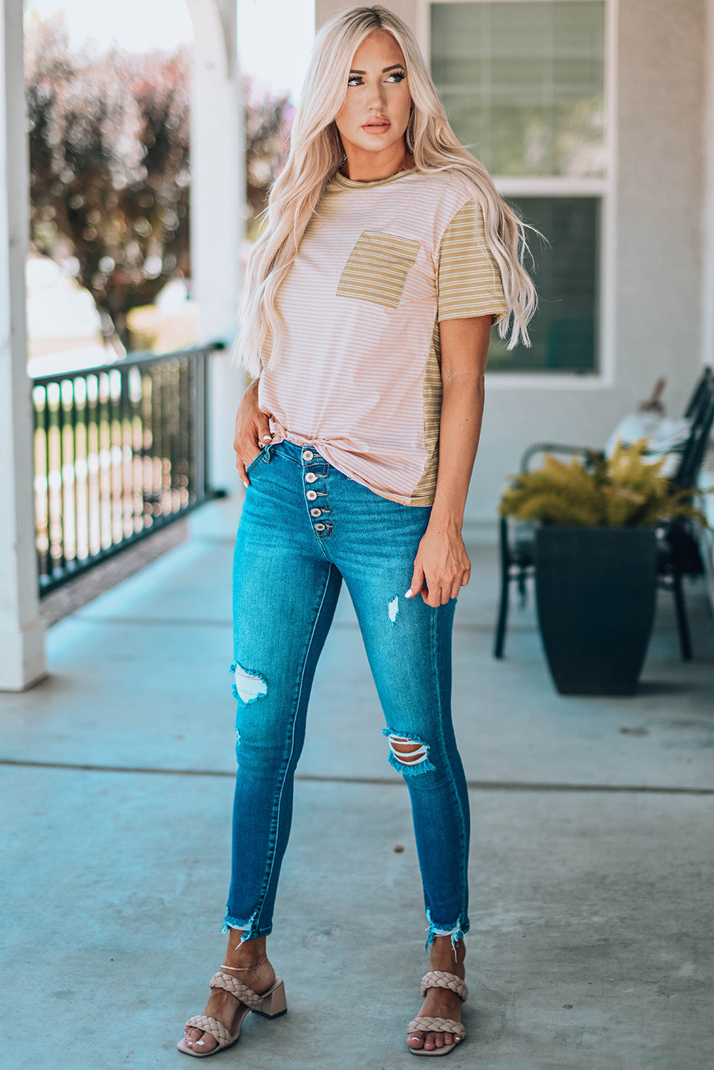 A stylish Contrast Striped Patchwork Tee featuring a round neckline, short sleeves, and a chest pocket, showcasing a vibrant color combination.