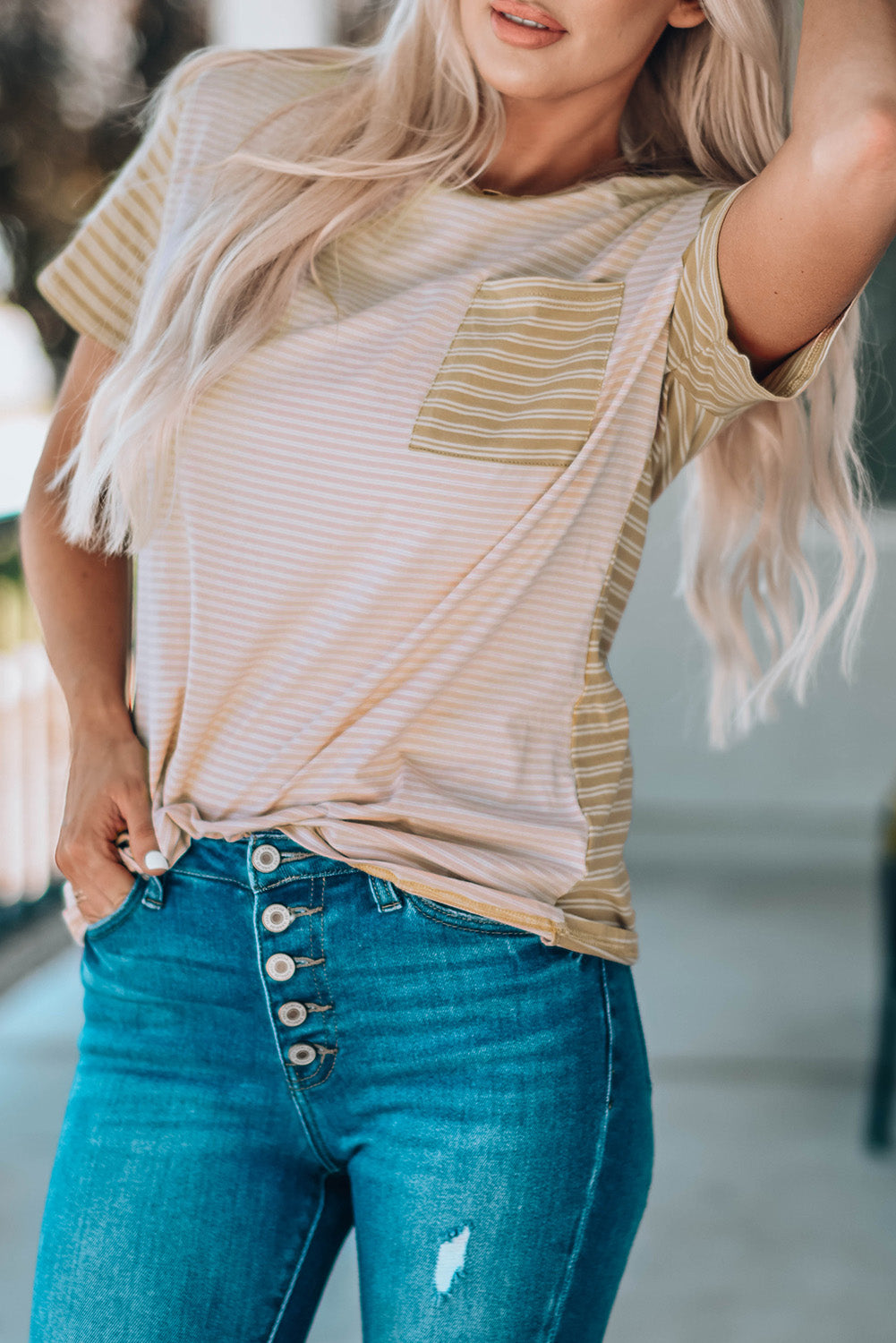 A stylish Contrast Striped Patchwork Tee featuring a round neckline, short sleeves, and a chest pocket, showcasing a vibrant color combination.