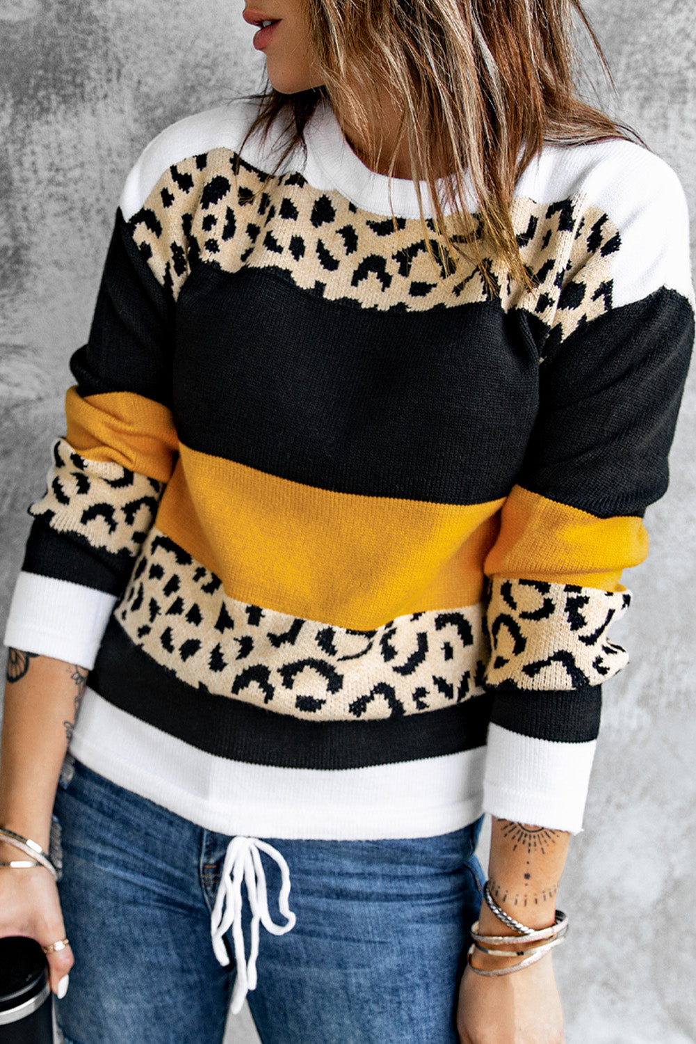 A stylish Crewneck Leopard Color Block Knit Pullover Sweater featuring a chic color block design and leopard pattern splicing, perfect for casual wear.