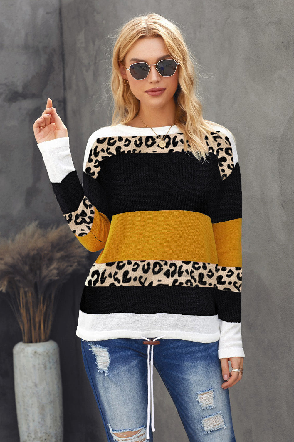 A stylish Crewneck Leopard Color Block Knit Pullover Sweater featuring a chic color block design and leopard pattern splicing, perfect for casual wear.