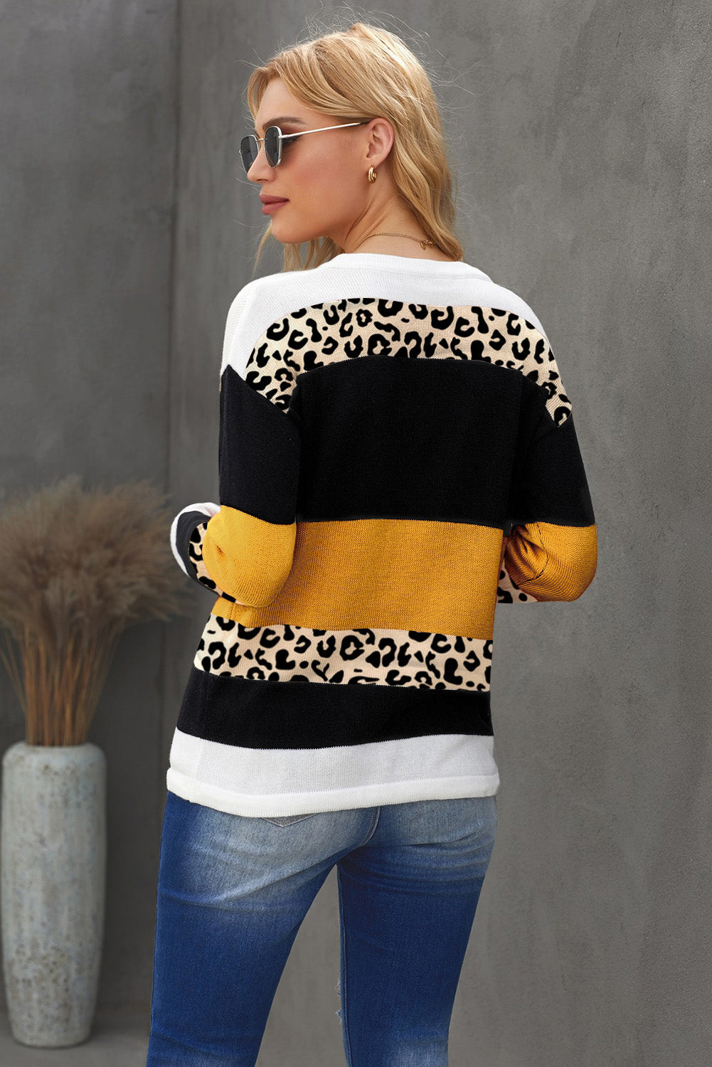 A stylish Crewneck Leopard Color Block Knit Pullover Sweater featuring a chic color block design and leopard pattern splicing, perfect for casual wear.