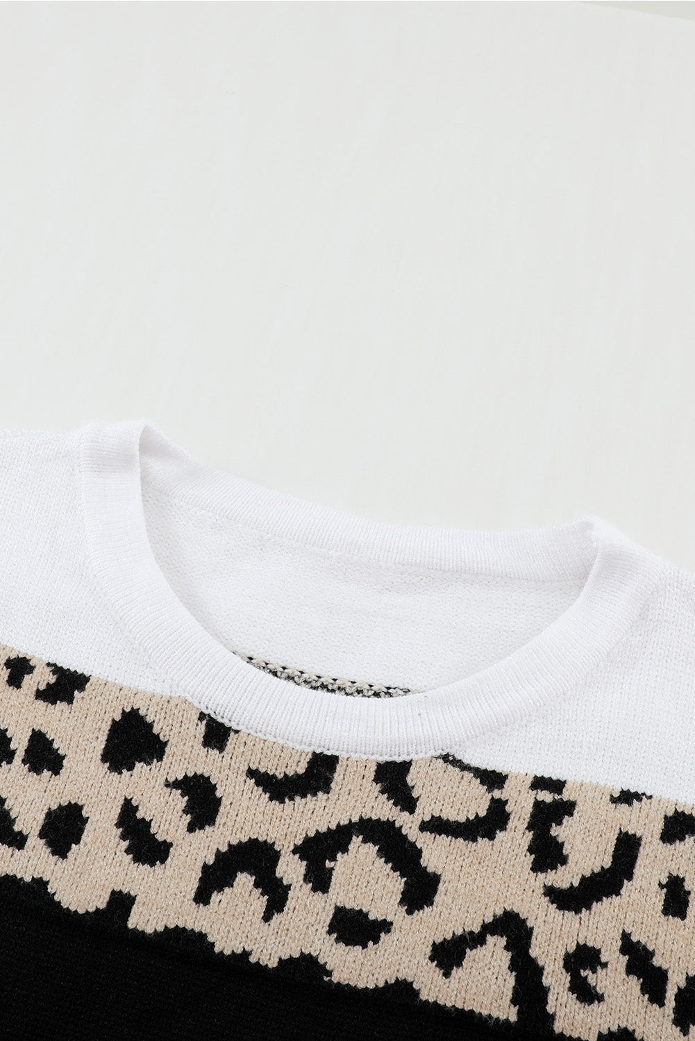 A stylish Crewneck Leopard Color Block Knit Pullover Sweater featuring a chic color block design and leopard pattern splicing, perfect for casual wear.