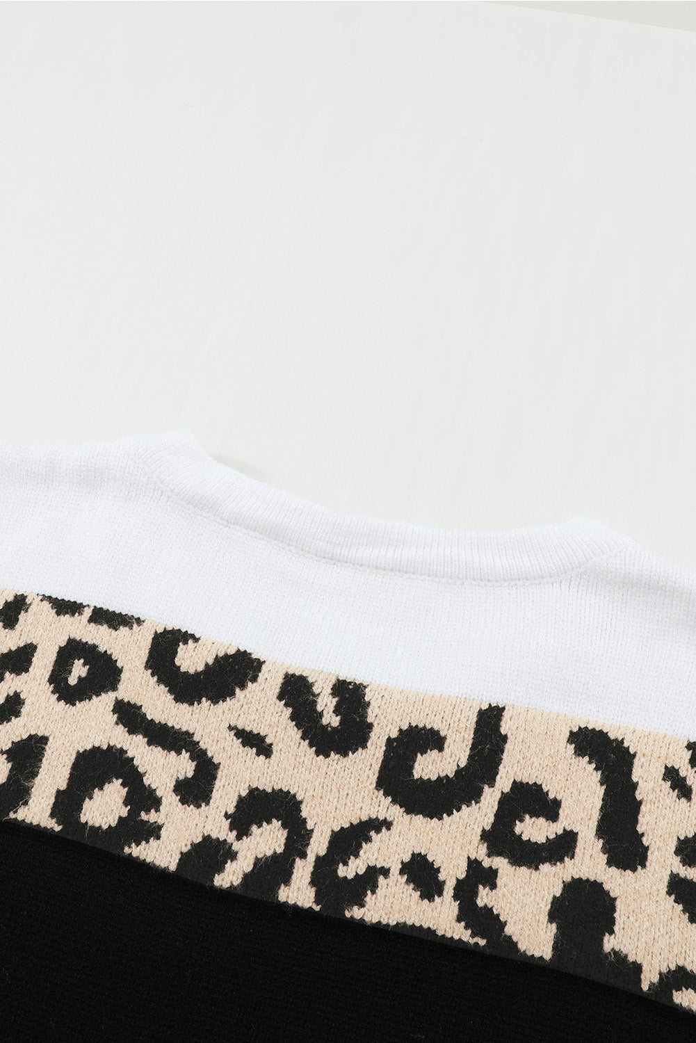 A stylish Crewneck Leopard Color Block Knit Pullover Sweater featuring a chic color block design and leopard pattern splicing, perfect for casual wear.