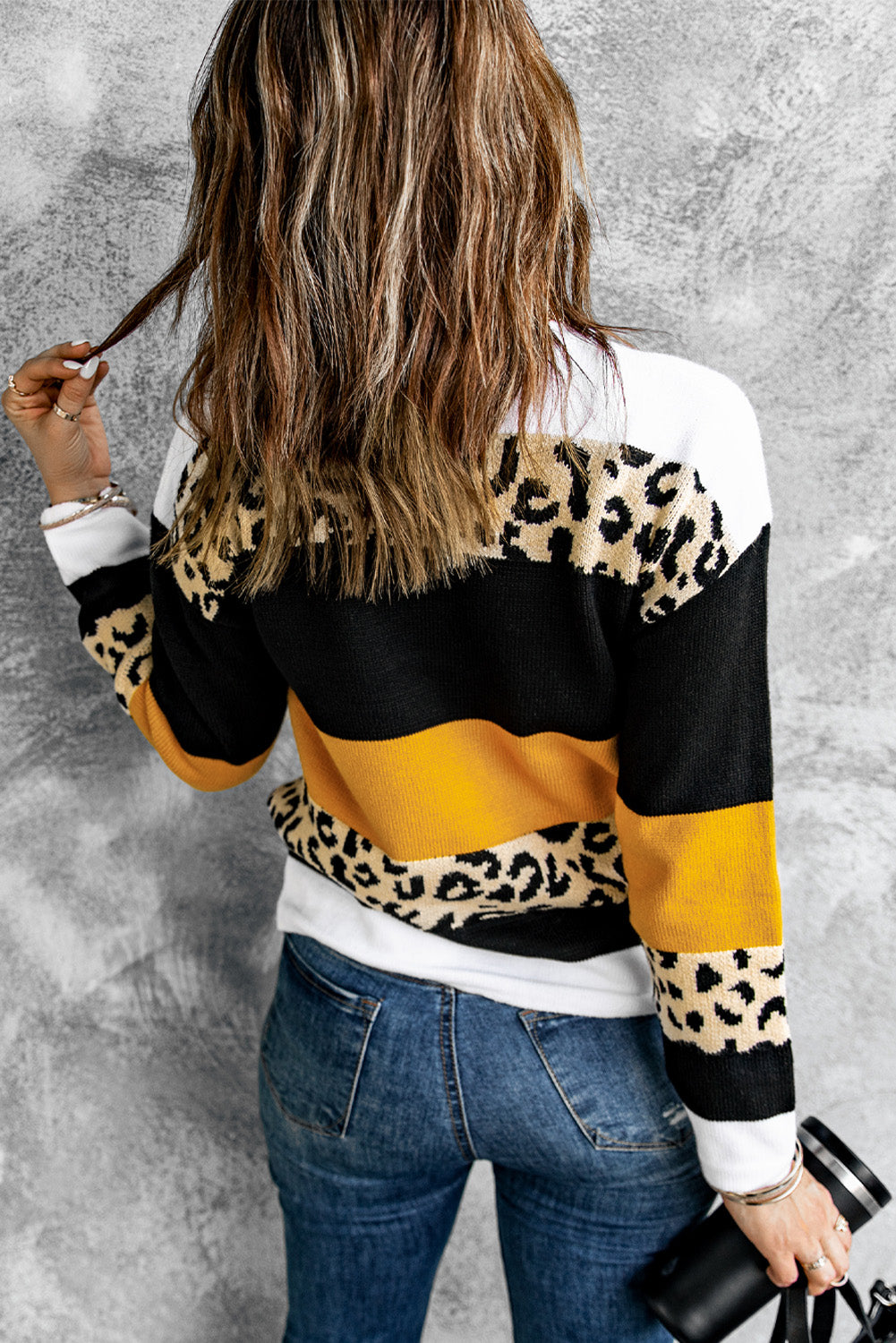 A stylish Crewneck Leopard Color Block Knit Pullover Sweater featuring a chic color block design and leopard pattern splicing, perfect for casual wear.