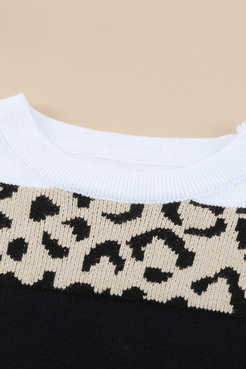 A stylish Crewneck Leopard Color Block Knit Pullover Sweater featuring a chic color block design and leopard pattern splicing, perfect for casual wear.