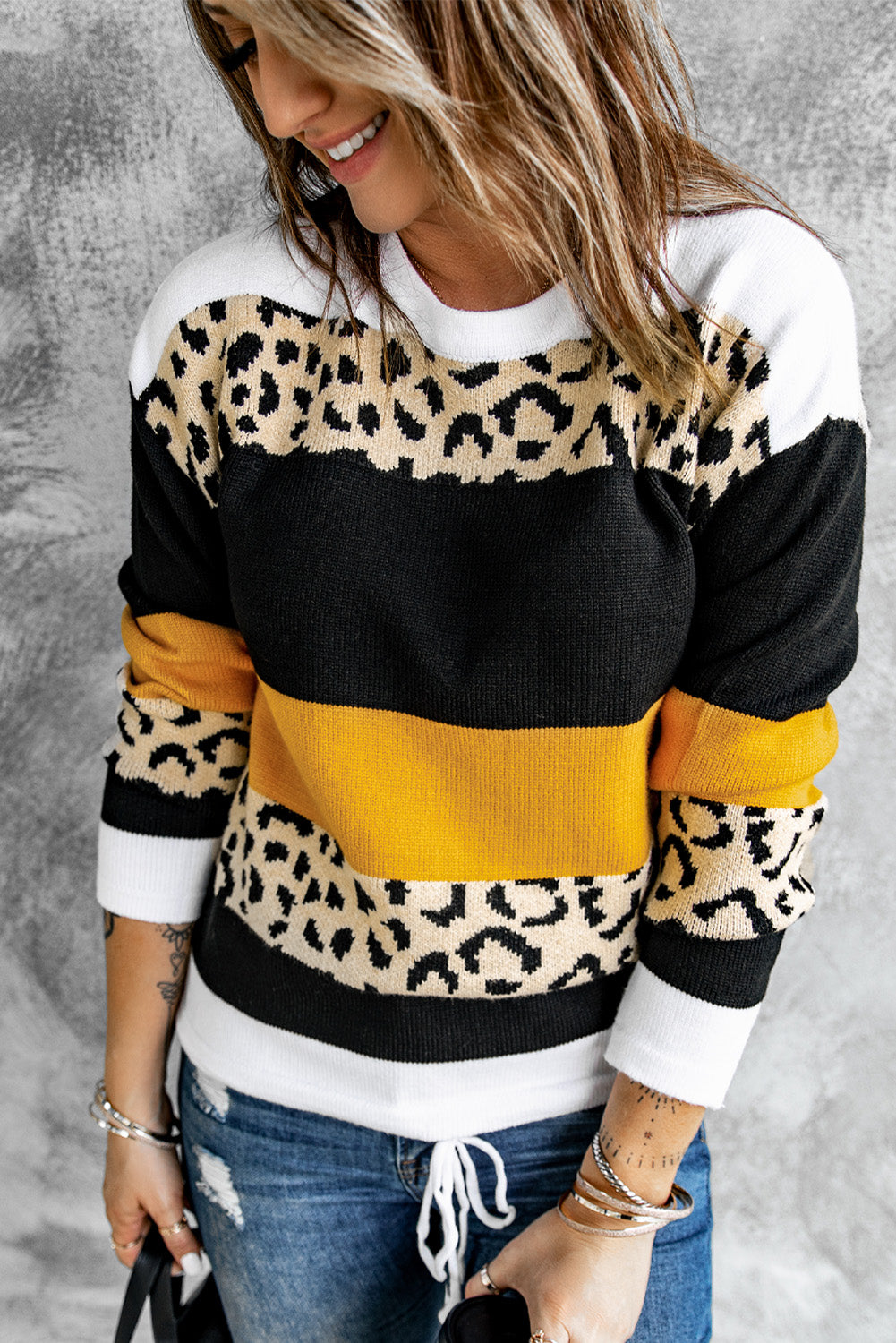 A stylish Crewneck Leopard Color Block Knit Pullover Sweater featuring a chic color block design and leopard pattern splicing, perfect for casual wear.