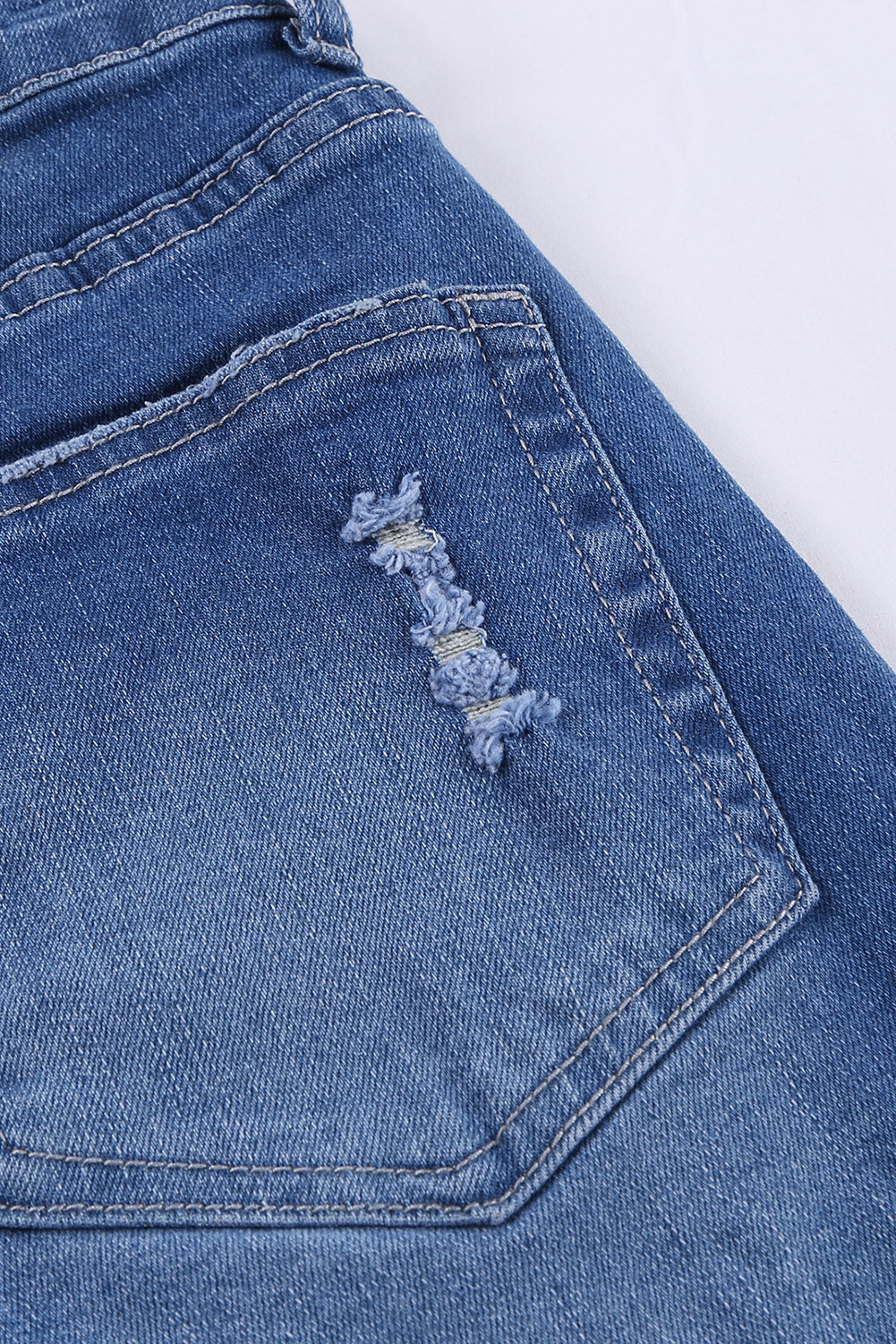 A pair of dark blue frayed hem denim shorts displayed on a white background, showcasing the stylish distressed design and pockets.