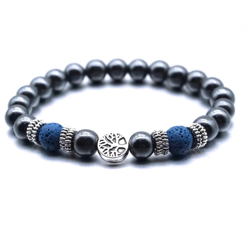 Dark blue lava stone bracelet with Tree of Life charm, showcasing its elegant design and essential oil absorption feature.