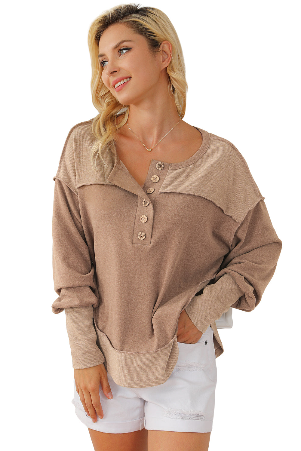 Dark brown sweatshirt featuring exposed seams, ribbed texture, thumbhole sleeves, and buttoned front, perfect for casual and active wear.