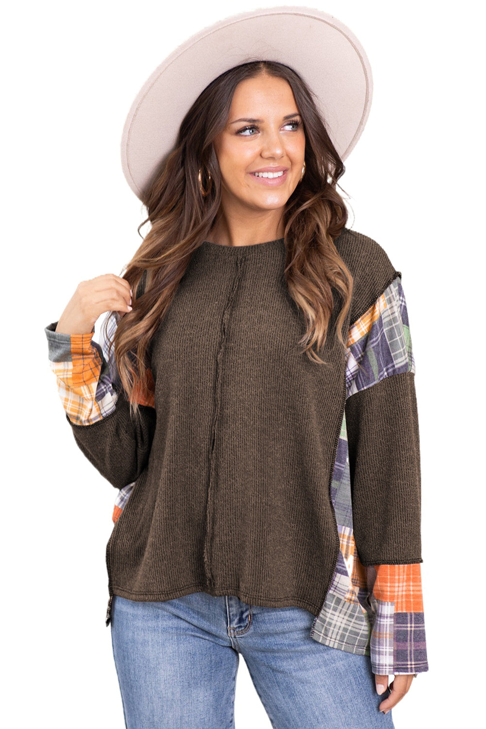 Dark brown plaid patchwork knit top with exposed seams and a high-low hem, showcasing a stylish and relaxed fit.