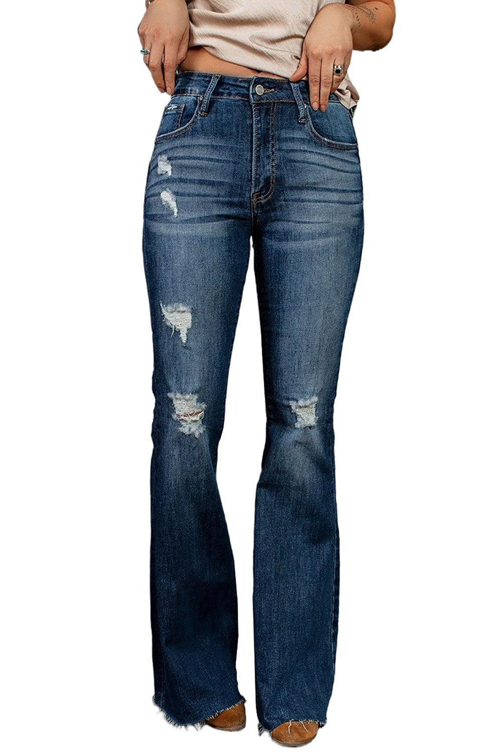 A pair of dark wash mid rise flare jeans featuring a trendy ripped design and raw hem detail, perfect for stylish casual wear.