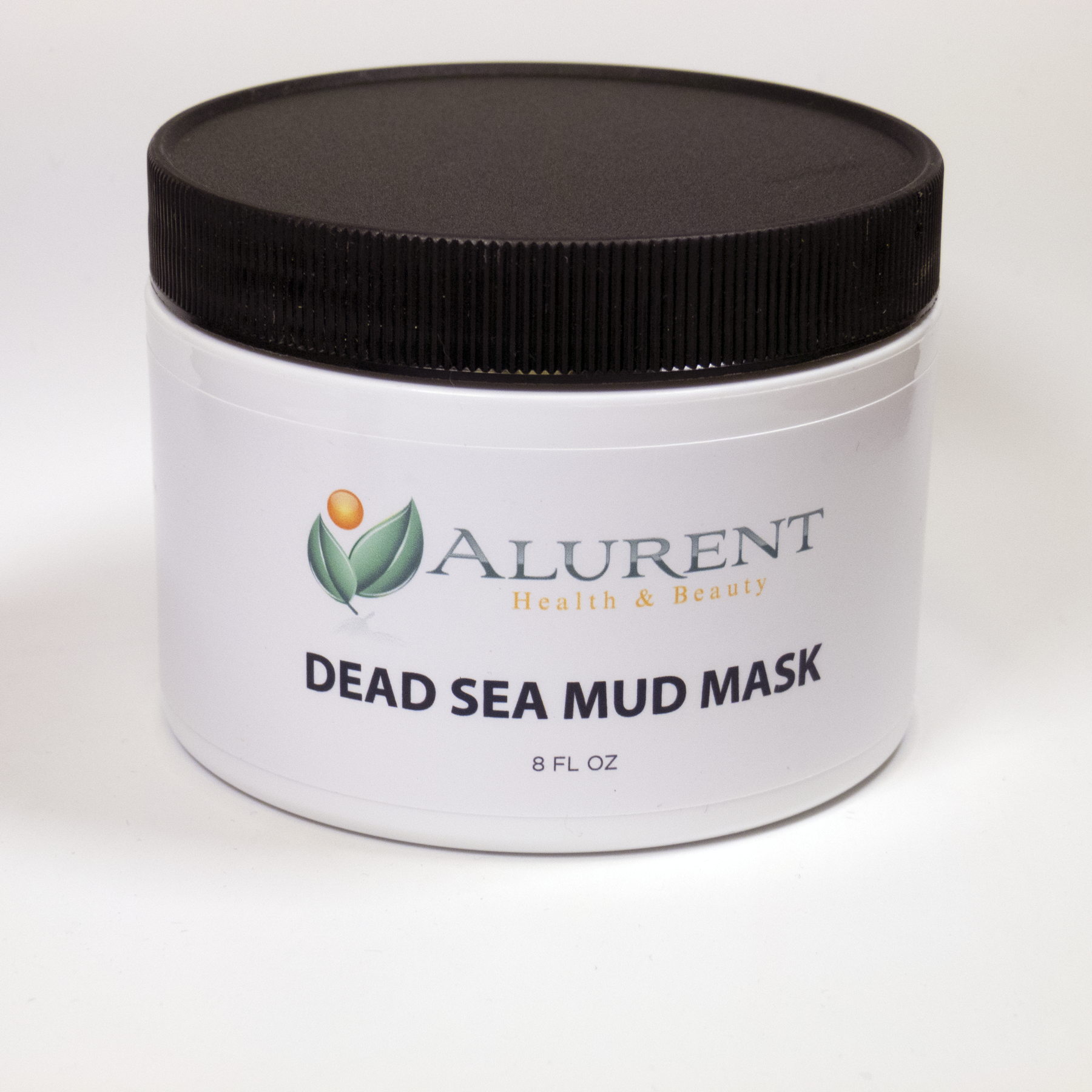 Alurent's Dead Sea Mud Mask in a jar, showcasing its rich, dark texture, surrounded by natural ingredients like clay and minerals.