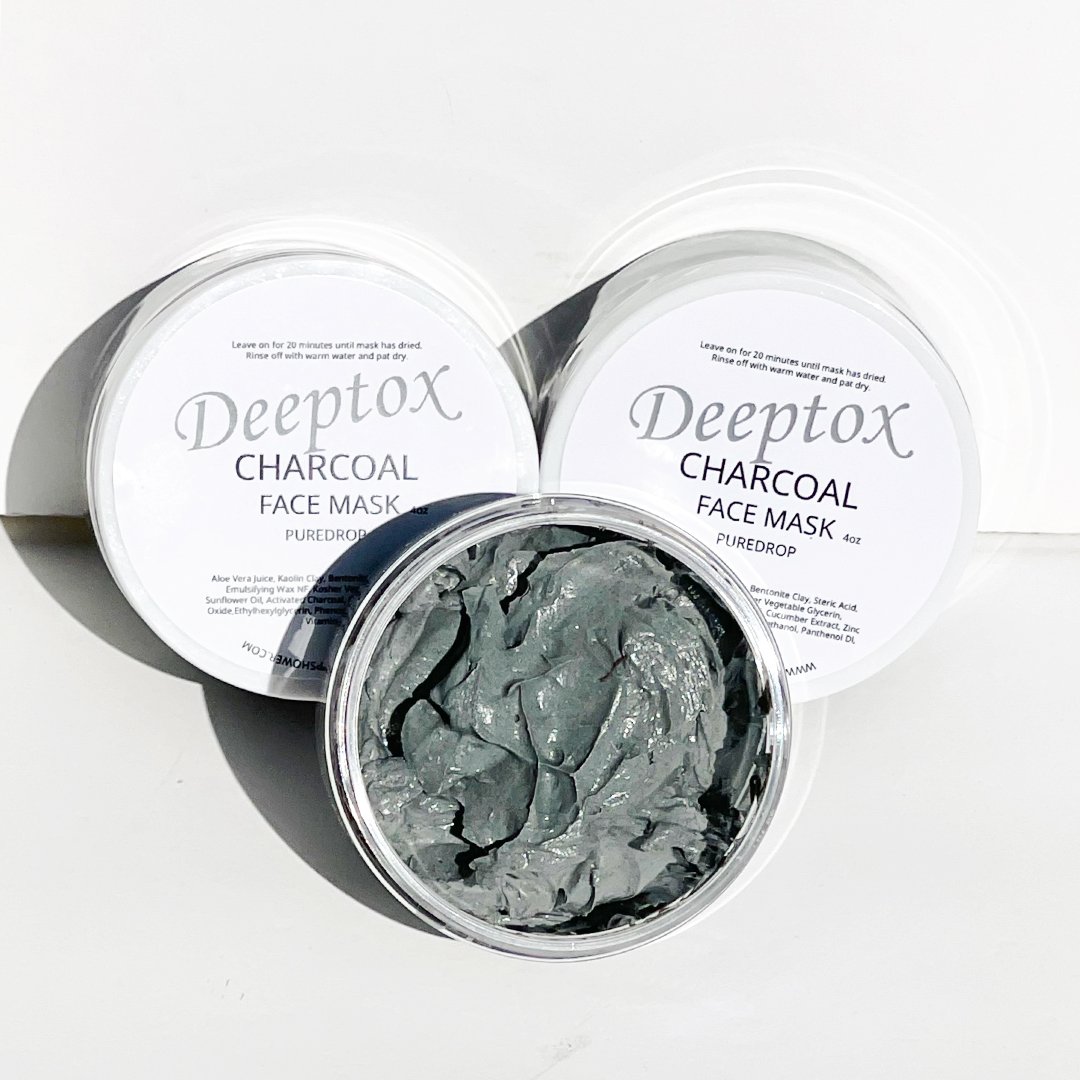 Deeptox Activated Charcoal Facial Mask in a sleek container, showcasing its rich, dark gel texture surrounded by natural ingredients.