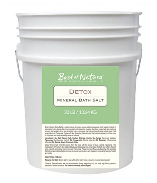 Detox Mineral Bath Salt in a shaker-top container, showcasing its natural ingredients and vibrant texture.