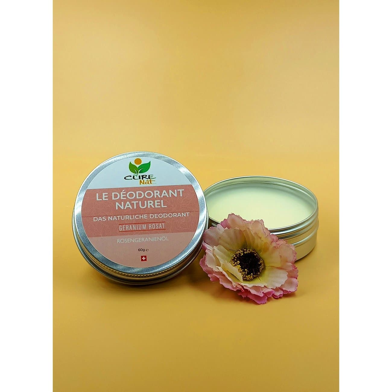 A jar of Déodorant Géranium Rosat showcasing its creamy texture and natural ingredients, with a delicate geranium rosat scent.