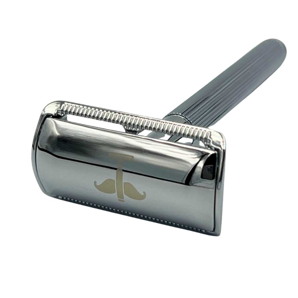 Double-Sided Safety Razor V2 with brass handle, covered tabs, and vertical ridges, available in silver, black, and gold.