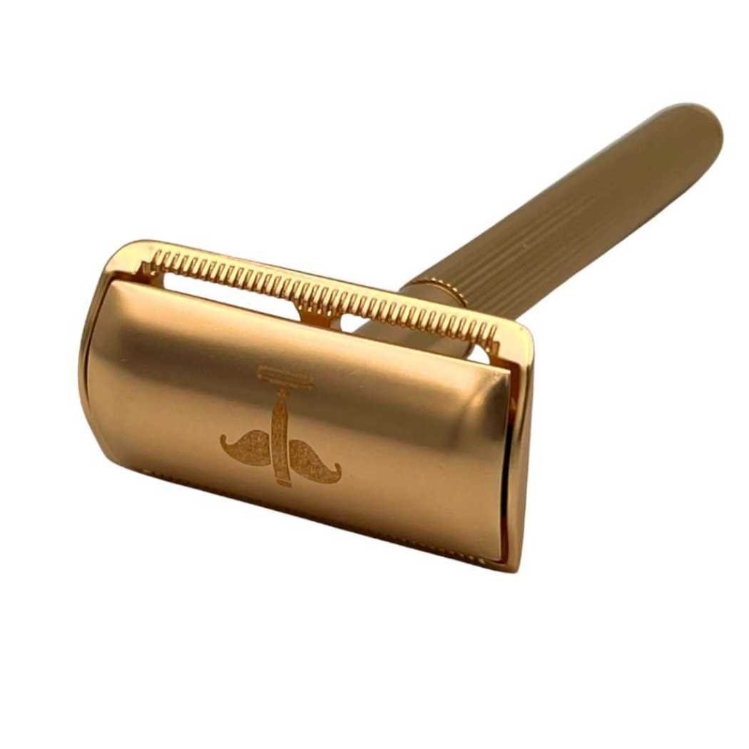 Double-Sided Safety Razor V2 with brass handle, covered tabs, and vertical ridges, available in silver, black, and gold.