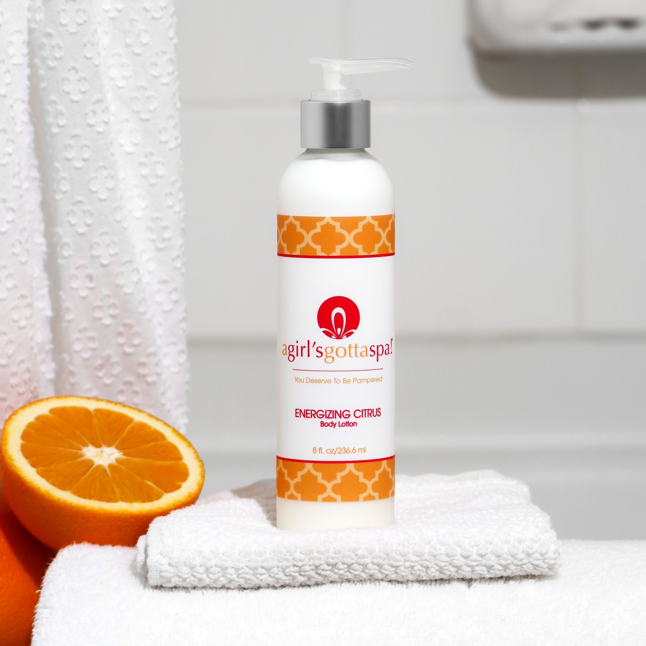 A bottle of Energizing Citrus Body Lotion with a vibrant citrus design, showcasing its refreshing and hydrating properties.