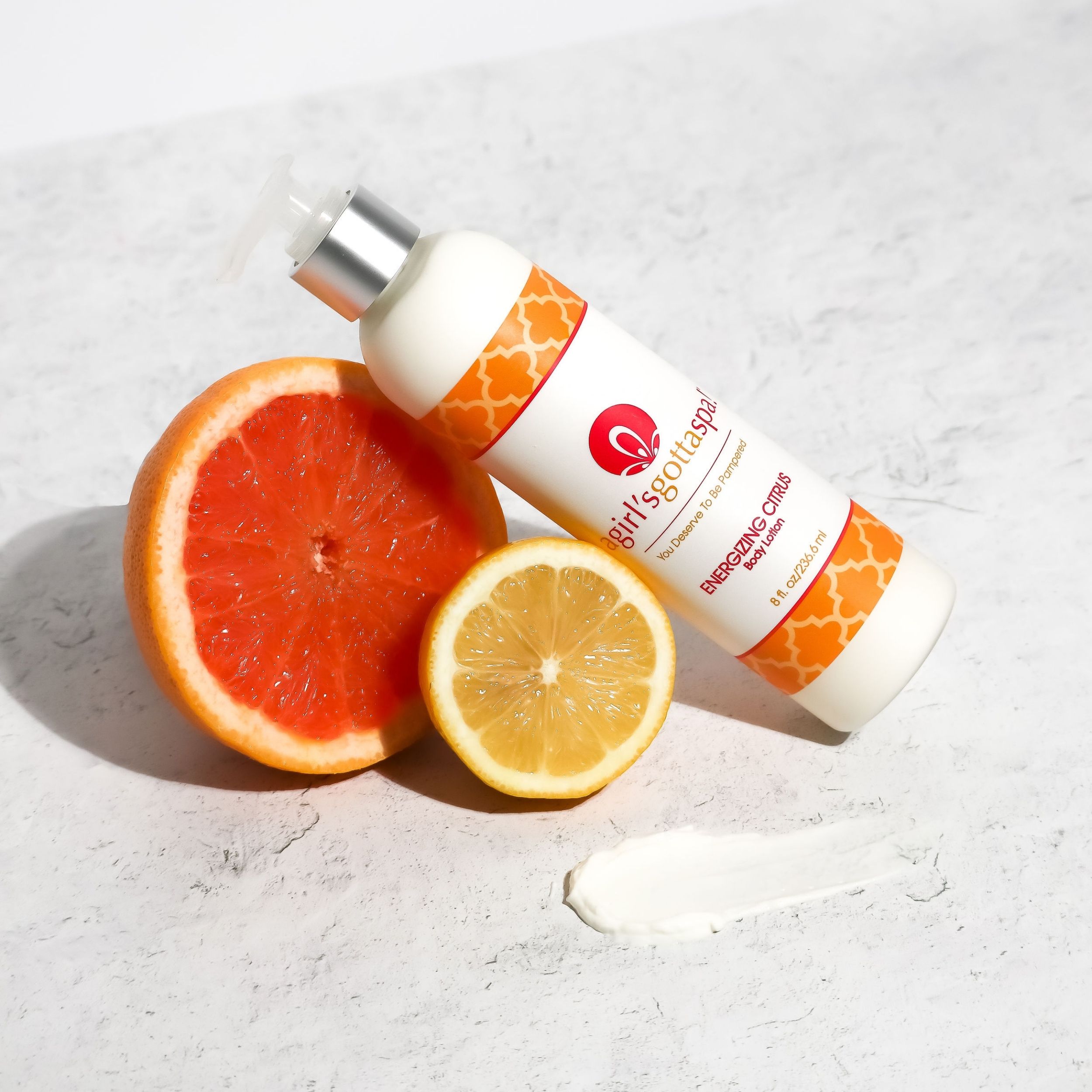 A bottle of Energizing Citrus Body Lotion with a vibrant citrus design, showcasing its refreshing and hydrating properties.