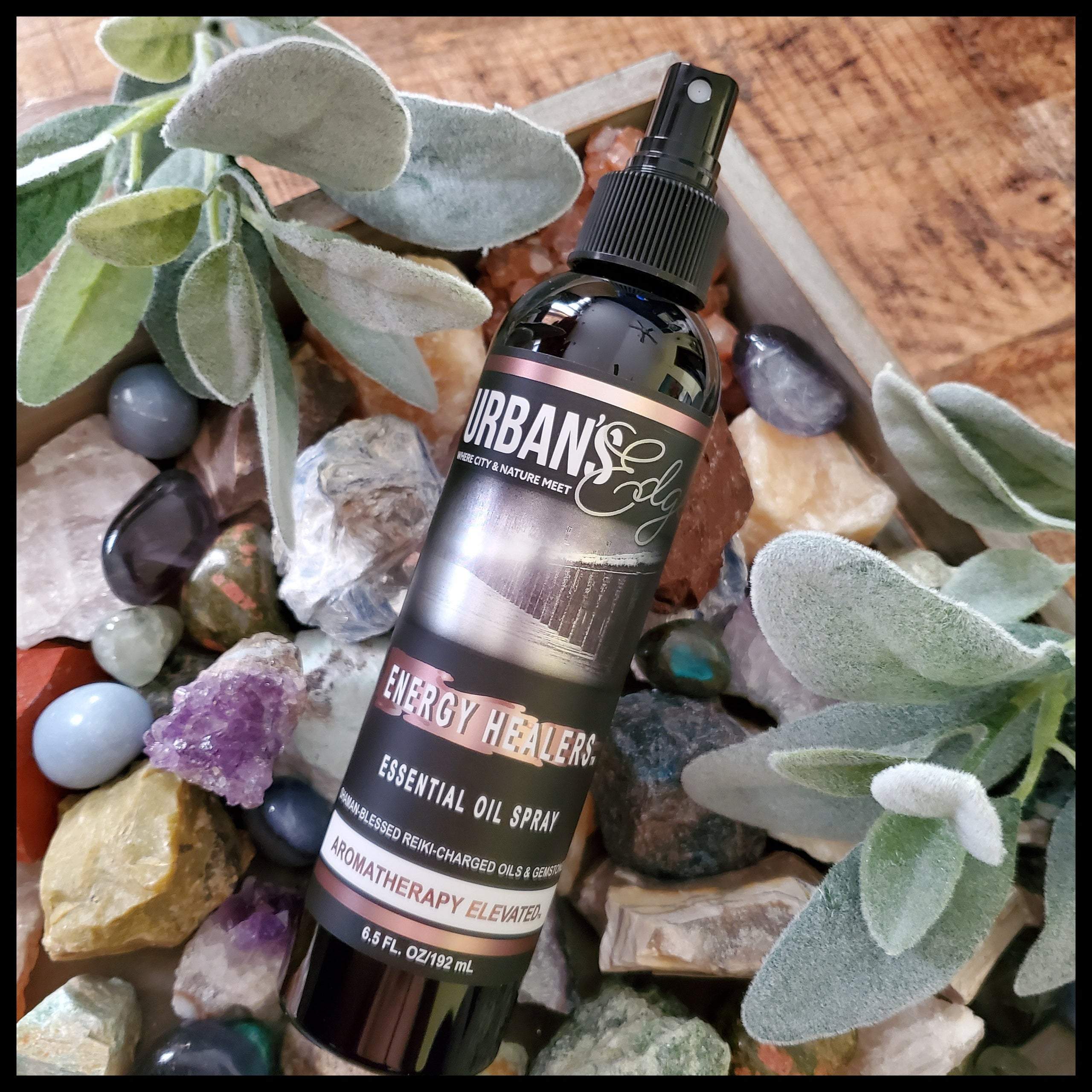 ENERGY HEALERS Essential Oil Spray bottle with a calming design, featuring essential oils and gemstones for energy healing.