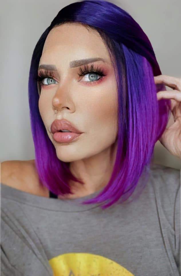 Envy (Purple Ombre') wig showcasing a beautiful ombre transition from black to deep purple to vibrant purple, featuring a transparent lace front.