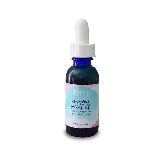 A bottle of everyday facial oil with a dropper, showcasing its lightweight texture and natural ingredients.