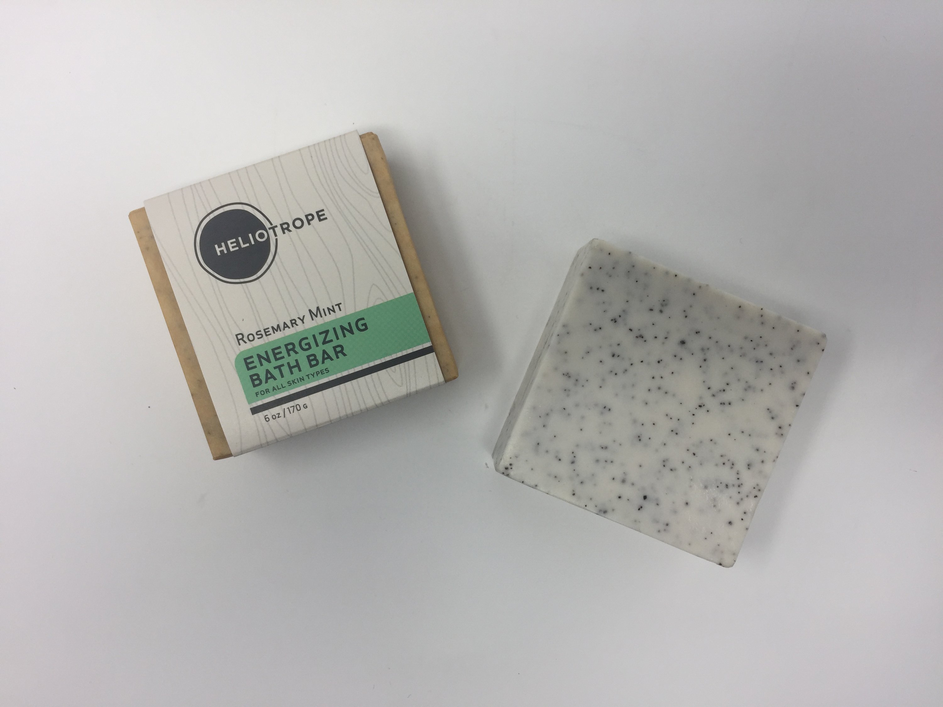 Exfoliating Bath Bars featuring goat's milk and crushed grapeseeds, showcasing creamy texture and natural ingredients.