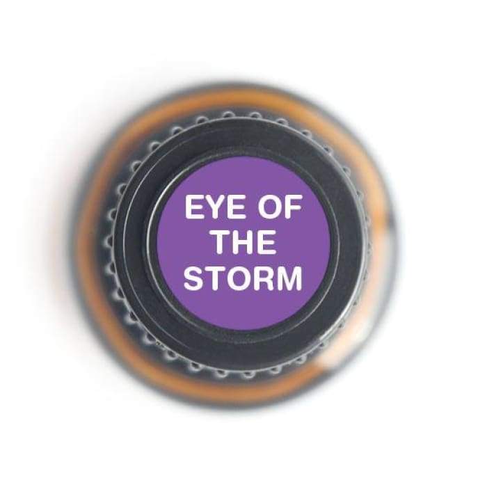 15ml bottle of Eye of the Storm Calm Blend Pure Essential Oil with a calming label design, surrounded by soothing natural elements.