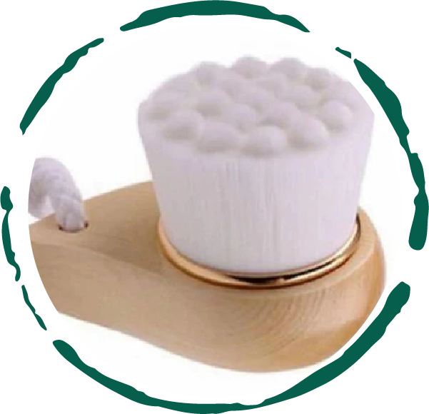 Facial brush with a bamboo handle and soft bristles, ideal for gentle exfoliation and cleansing of the face.