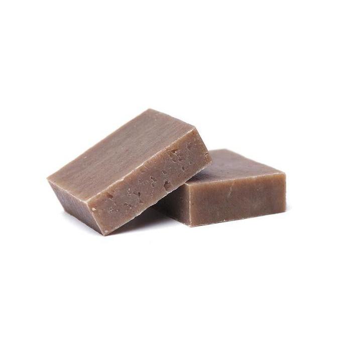 Fairchild's Chocolate Soap bar with rich chocolate color and creamy texture, surrounded by cocoa beans and natural ingredients.