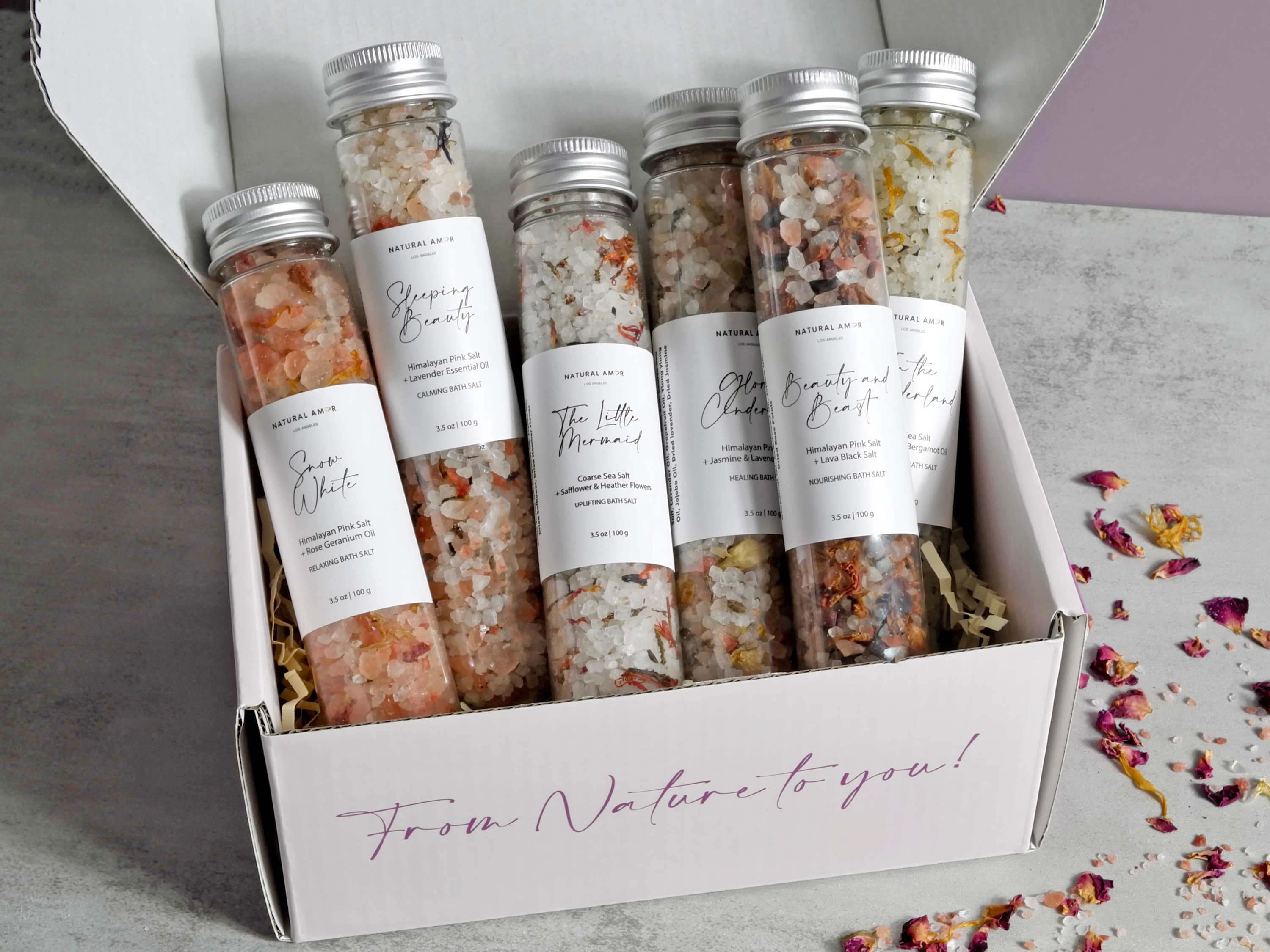 Fairy Tale Tube Bath Salt Gift Set featuring colorful tubes with natural ingredients and dried flowers for a relaxing bath experience.