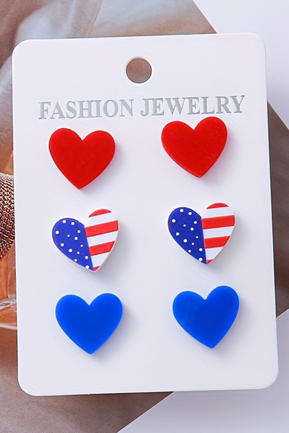 Fiery Red American Flag Print Heart Shape Stud Earrings Set displayed on a white background, showcasing their vibrant colors and unique heart shape.