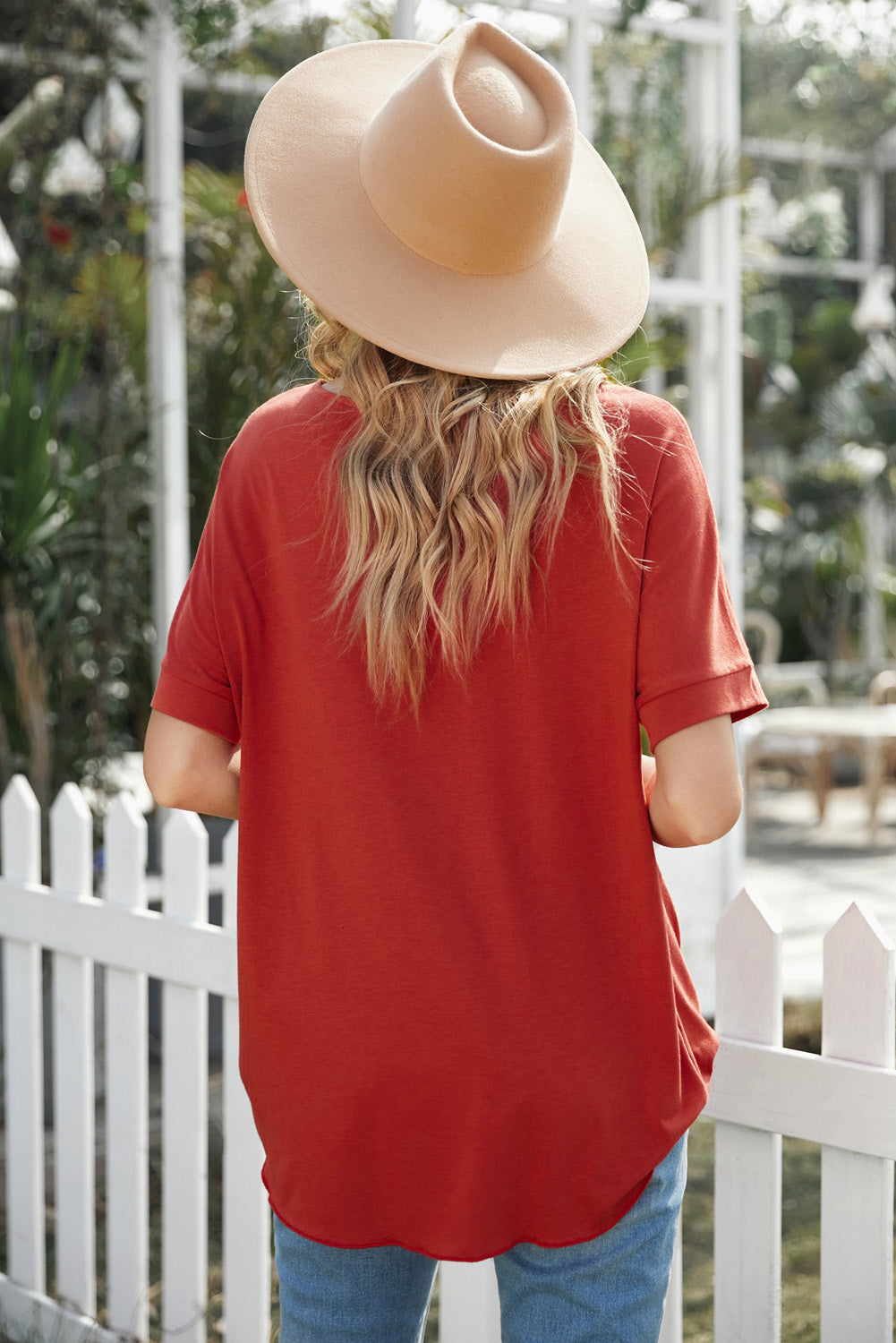 Fiery Red Short Sleeves Drape Knit Top with elegant twist design, featuring a sewn v-neckline and cuffed short sleeves.