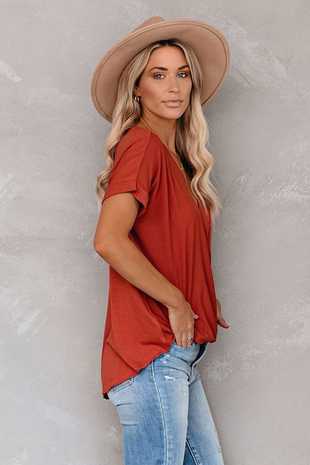 Fiery Red Short Sleeves Drape Knit Top with elegant twist design, featuring a sewn v-neckline and cuffed short sleeves.