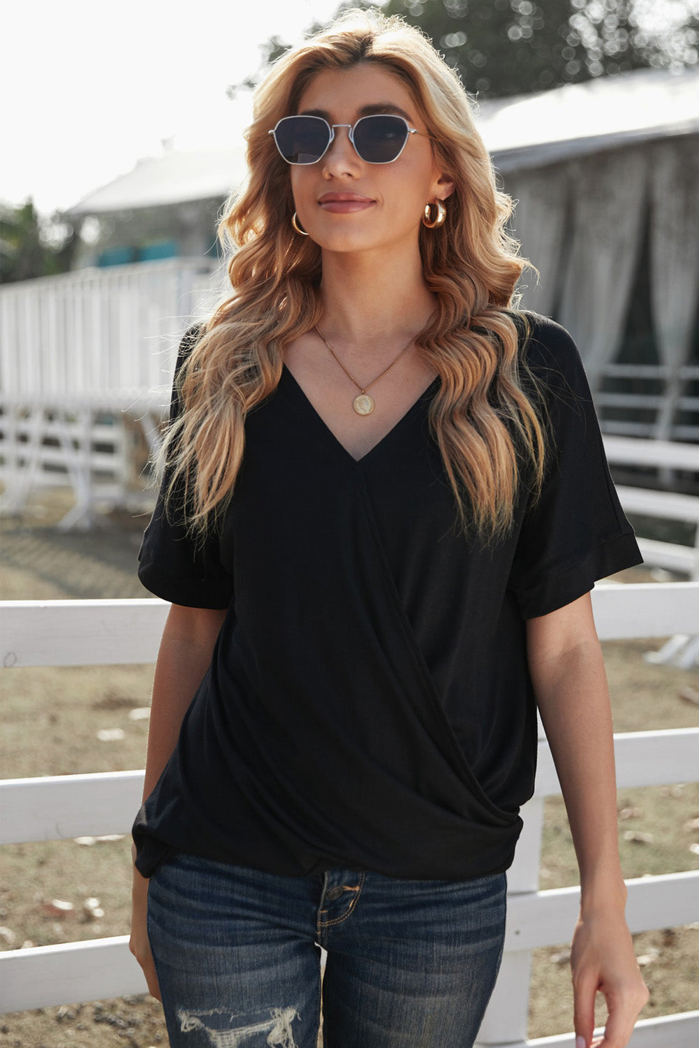 Fiery Red Short Sleeves Drape Knit Top with elegant twist design, featuring a sewn v-neckline and cuffed short sleeves.