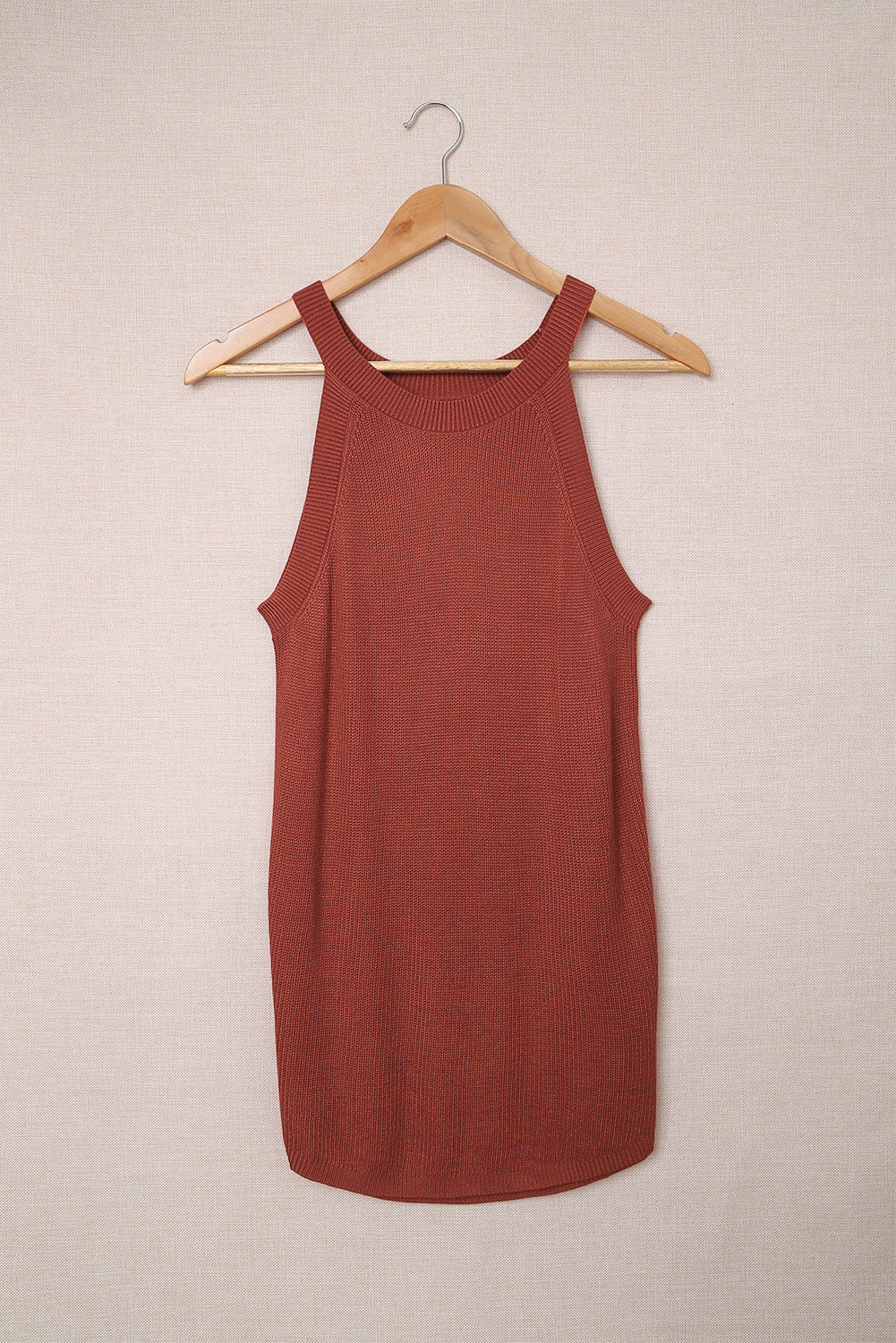 Fiery red solid ribbed knit slim-fit tank top displayed on a mannequin, showcasing its stylish design and texture.